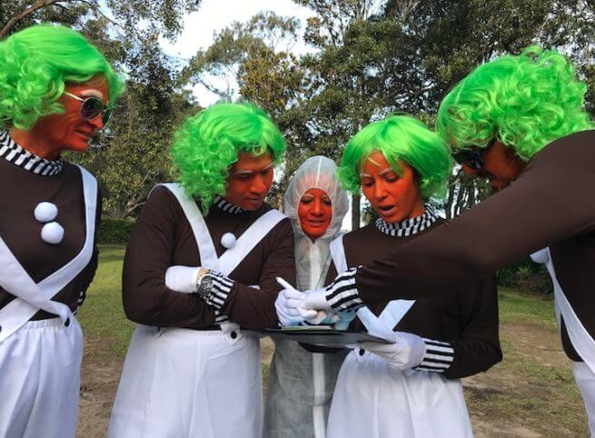 Oompa Loompa Costume Team Doing Amazing Race Solving Clues