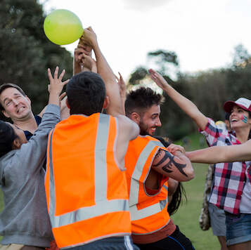 Funny Outdoor Team Building Challenge High-Vis Smiling