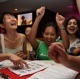 Girls Cheering After Completing Puzzle In Amazing Race With Bars